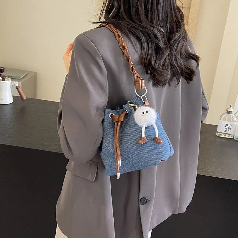 Blue one-shoulder cross body bucket messenger bag with synthetic leather lining