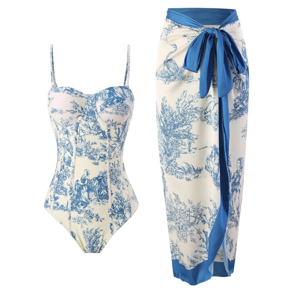 Blue women's one-piece swimsuit with a separate matching gauze skirt laid flat.
