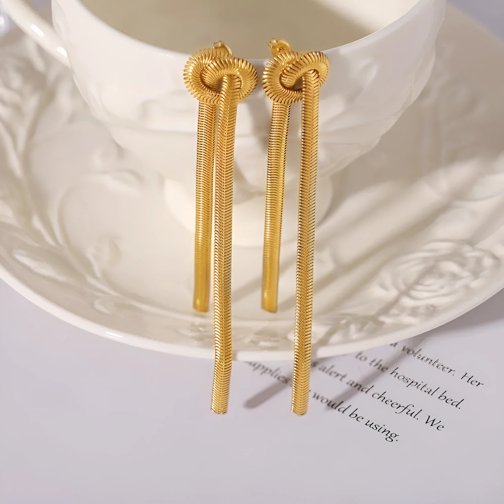 Gold electroplated titanium steel necklace with knotted tassel pendant and matching earrings