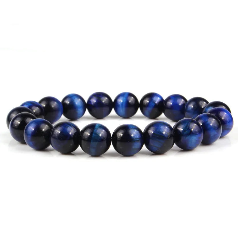 Natural tigereye crystal beaded bracelet with round beads, shown in a selection of colours and sizes on a wrist.