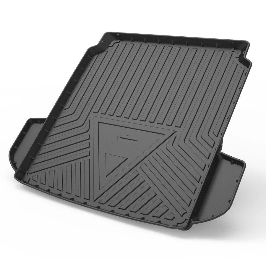 Black TPE car boot liner with a carbon fibre texture pattern laid flat.