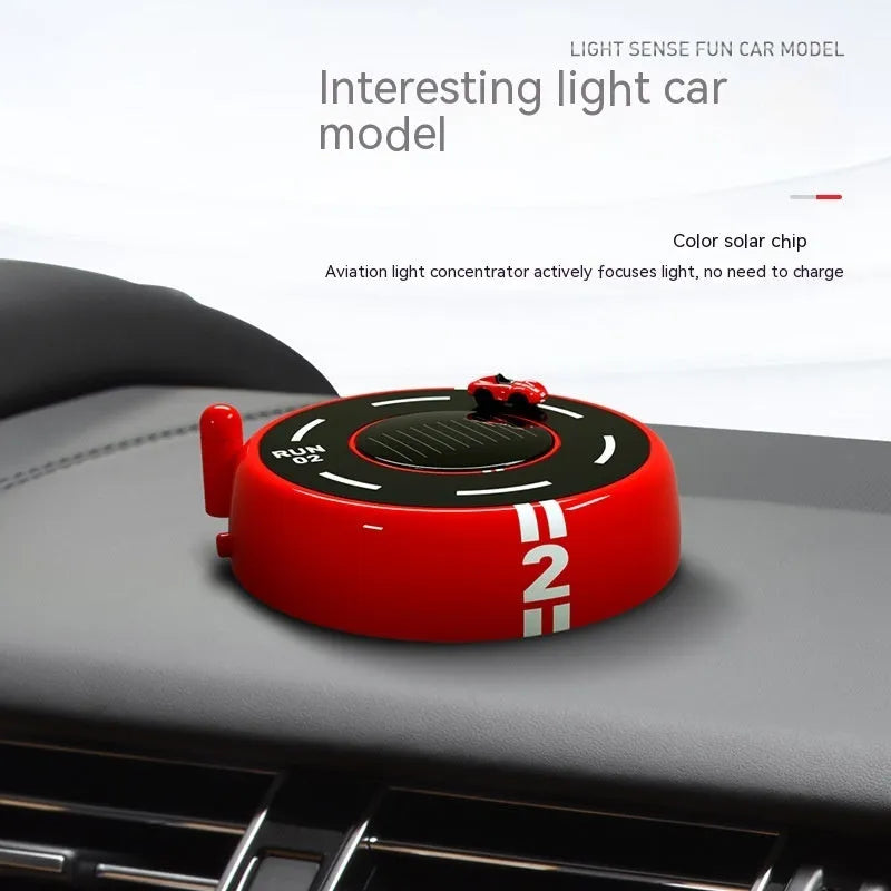 Black, red, and white round car model solar aromatherapy decoration for vehicle fragrance.