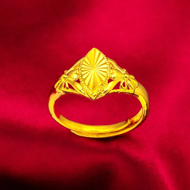 Geometric brass flower ring with gold electroplated finish showing textured diamond design