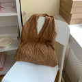 Women's retro hollow knitted woolen yarn shoulder tote bag in a solid colour with double straps.