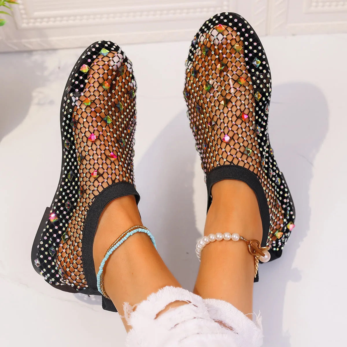Women's flat sandals with mesh upper and colourful rhinestone decoration, round toe design