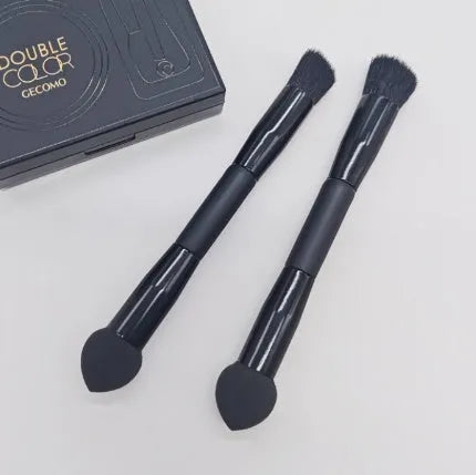 Double-headed makeup brush with black sponge end and pointed brush end on wooden handle