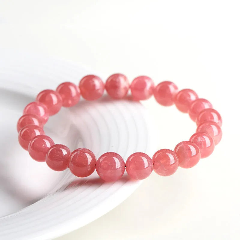 Women's geometric crystal bracelet with longevity lock in natural red rhodochrosite stone patterns