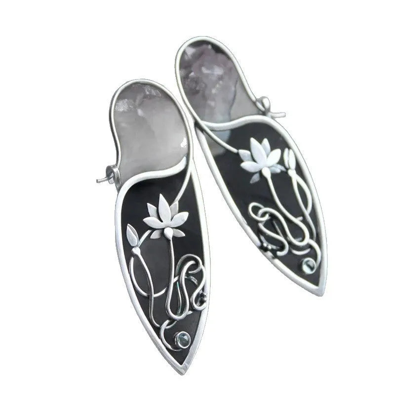 A pair of silver women's earrings with a lotus vine and geometric design featuring round rhinestones.