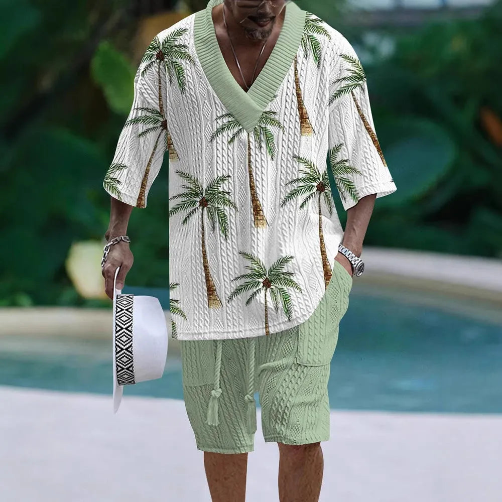 Man wearing a loose-fitting light blue short sleeve top and matching shorts casual suit set.