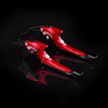 Pair of anodised metal motorcycle brake and clutch levers with adjustable length mechanism.