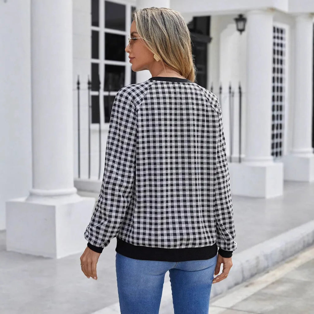 Black long sleeve polyester sweater with striped plaid print pattern