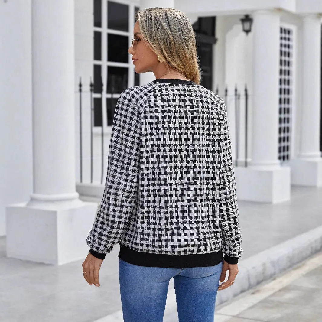 Black long sleeve polyester sweater with striped plaid print pattern