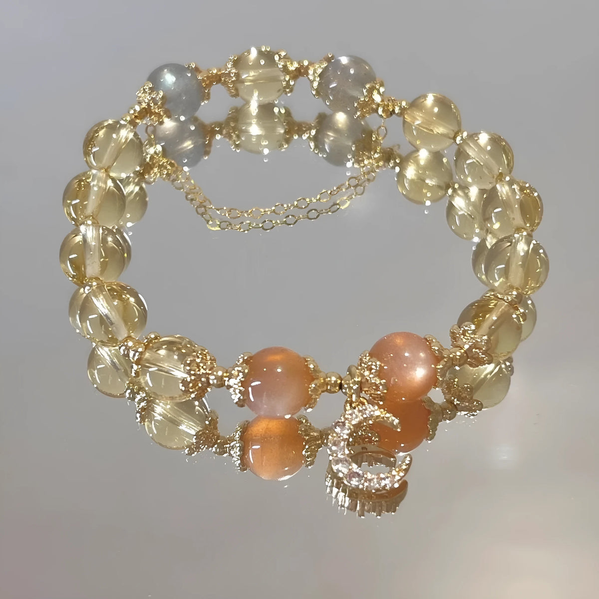 Chinese style crystal bracelet with 14K gold electroplated finish and diamond-shaped design