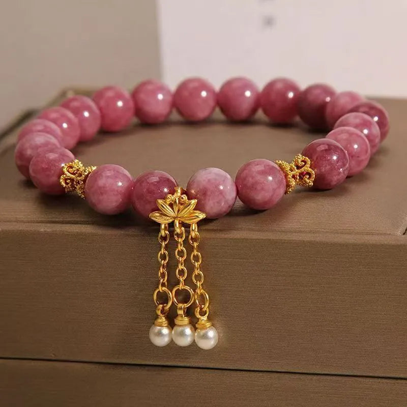 Pink lotus tassel bracelet with natural stone beads and crystal accents