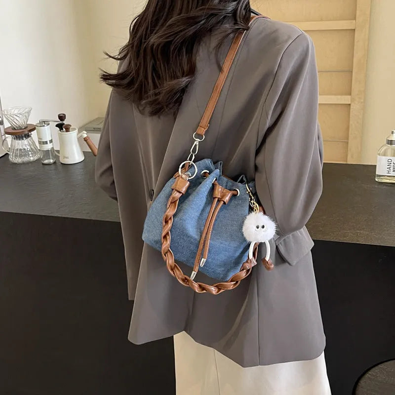 Blue one-shoulder cross body bucket messenger bag with synthetic leather lining