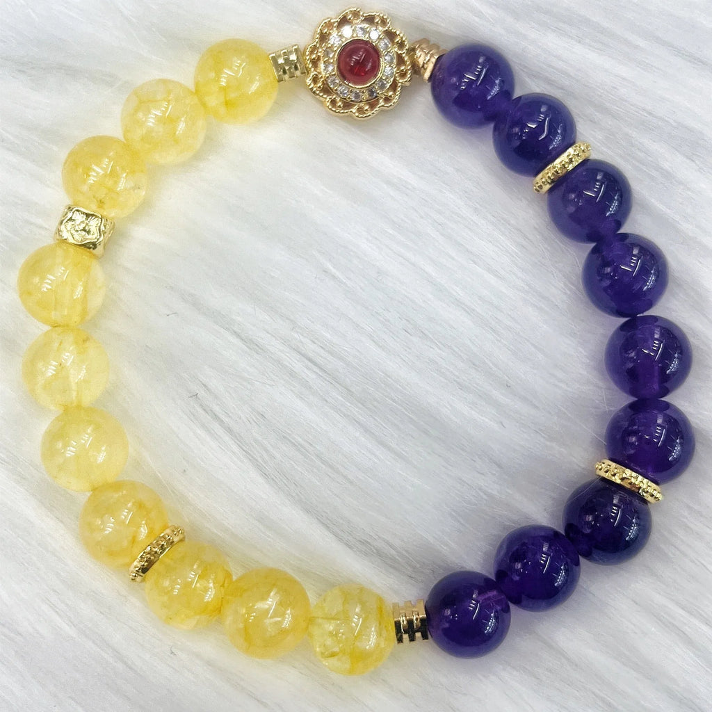 Handmade women's yellow and purple crystal bracelet with amethyst beads on wrist
