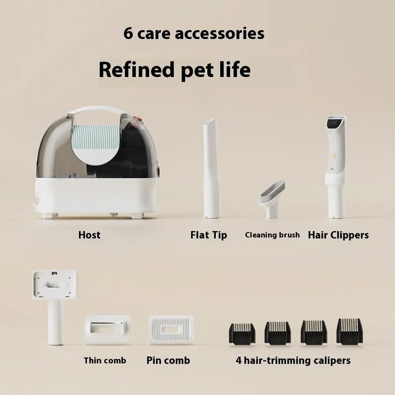 Pink and white pet grooming vacuum cleaner with attached hose and electric shaver grooming tool on a white background.