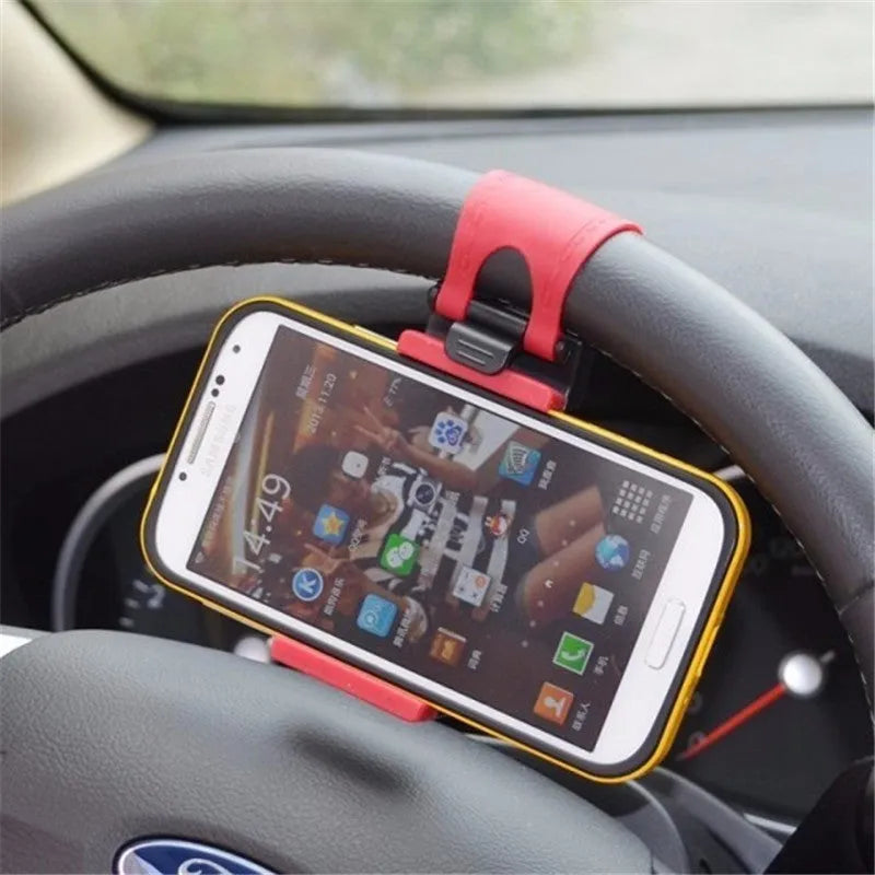 Black universal steering wheel phone holder clip for smartphones showing silicone pad
