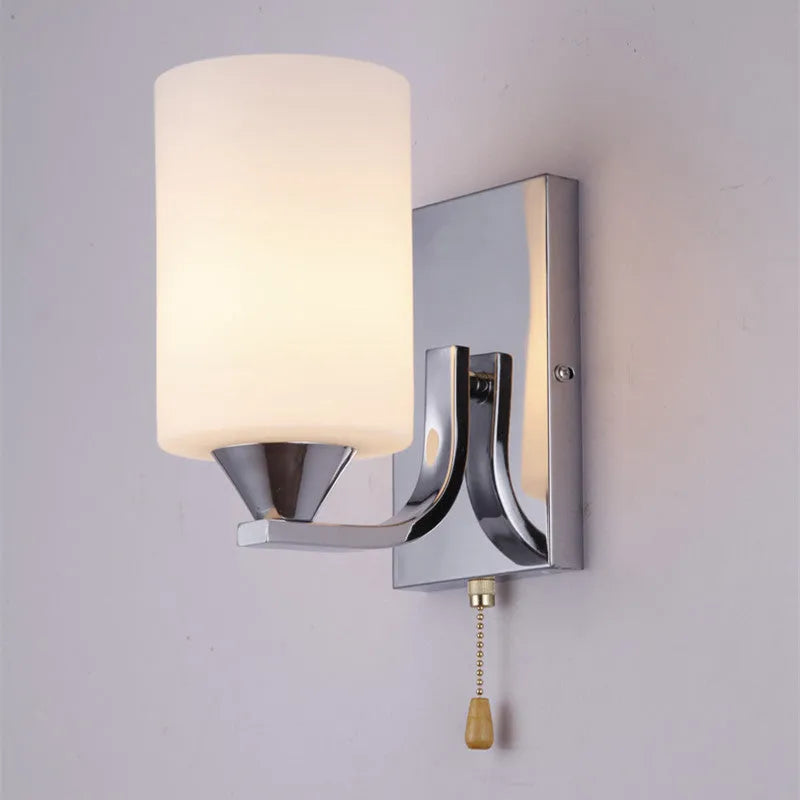Chrome-finished minimalist glass wall lamp with adjustable dual heads for bedside lighting