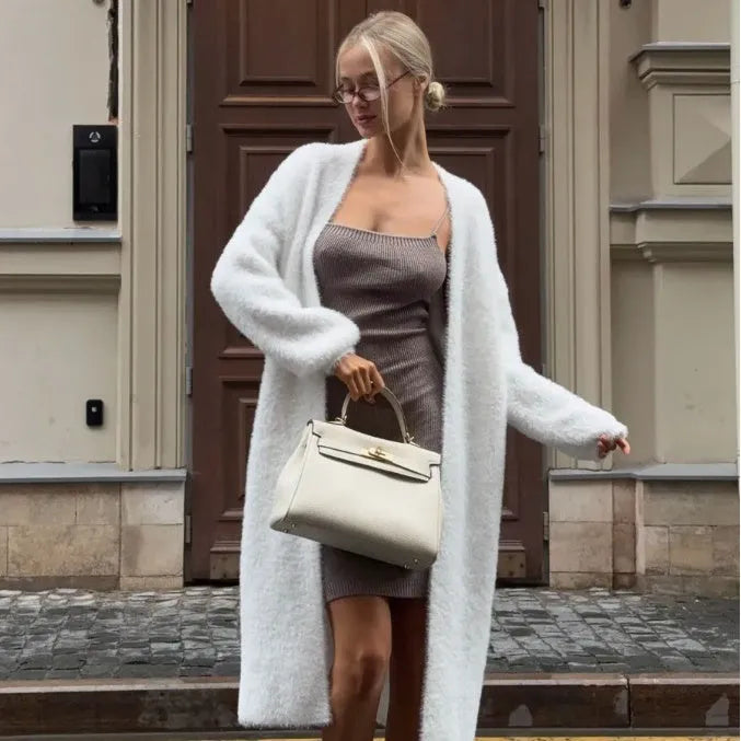 White thick knitted women's cardigan jacket with extended length and loose fit design