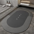 Blended fabric bathroom floor mat shown in an oval shape on a tiled floor, available in blue, green, grey.