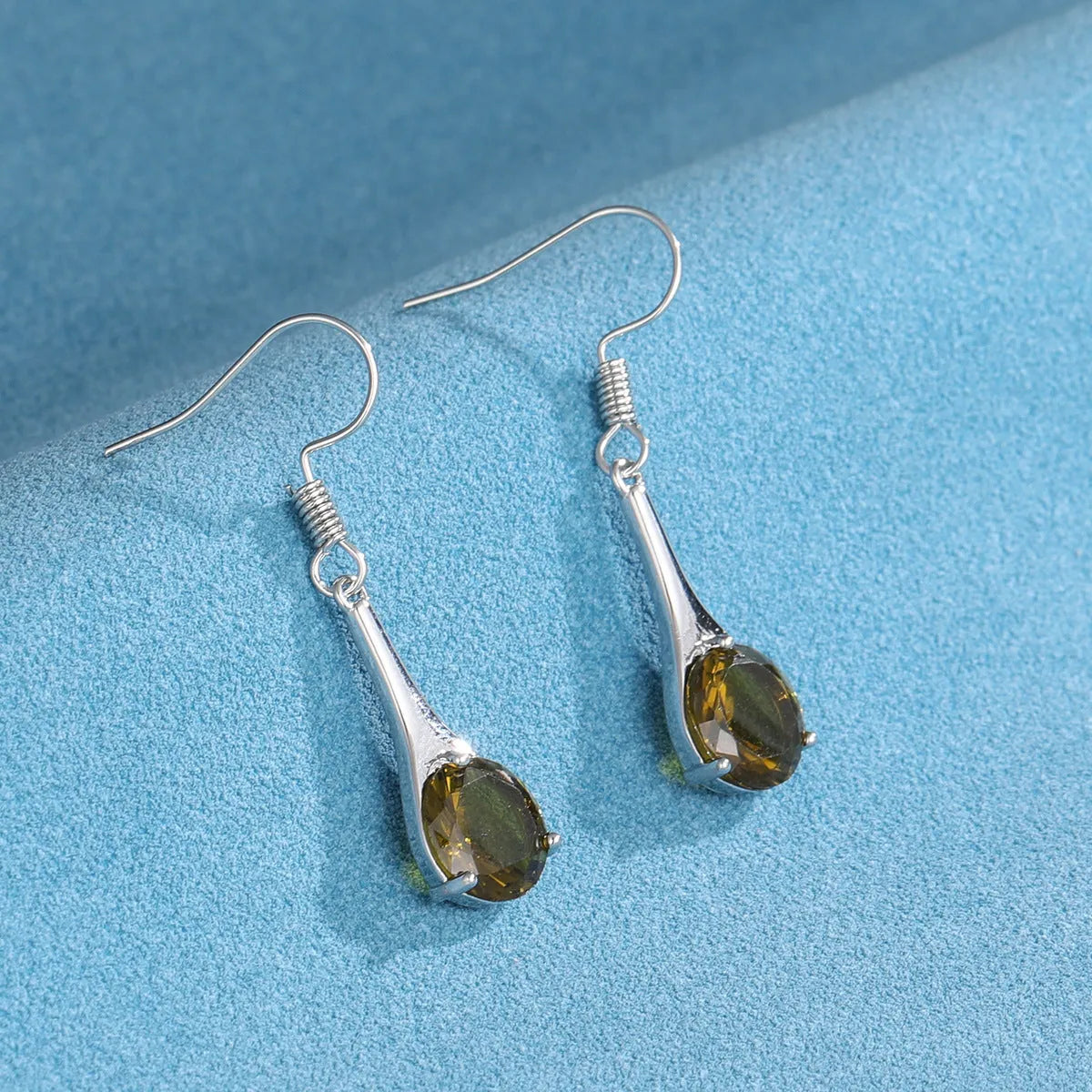 Olive green topaz coloured drop earrings with water drop shape and electroplated finish