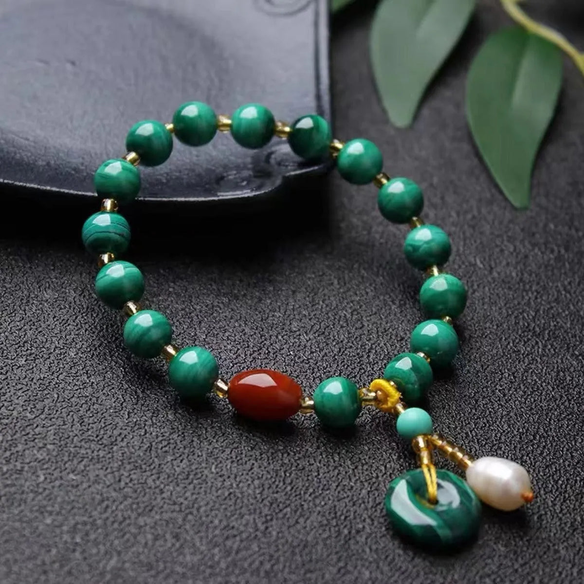 Natural green malachite bracelet with red agate barrel beads measuring 7-8mm