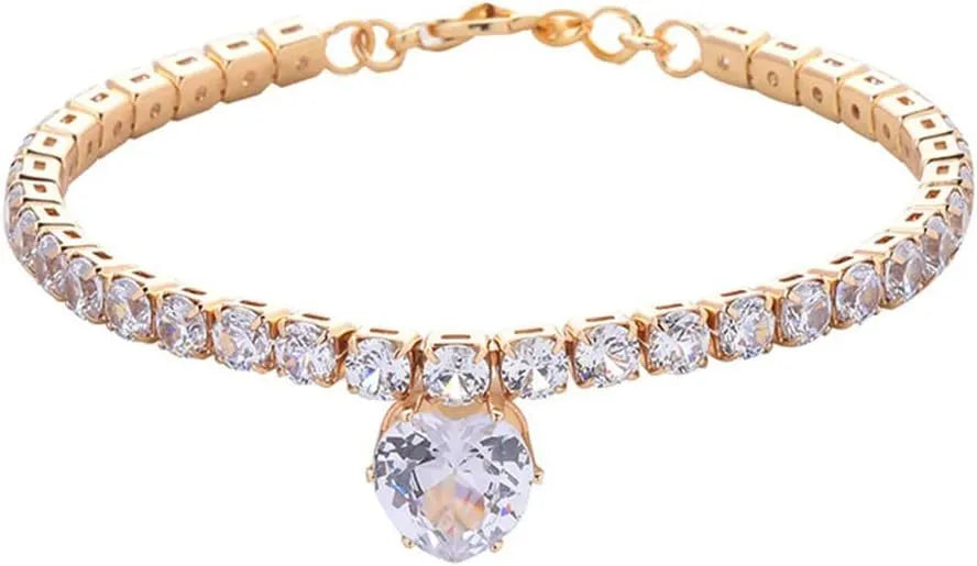 Gold rhinestone heart-shaped collar for a dog or cat on a white background.