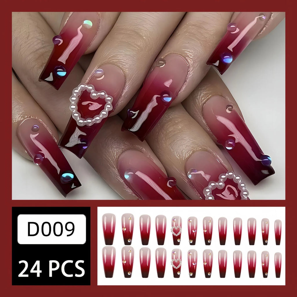 Wine red gradient fake nail tips with a pearl heart and plaid design in a long ballet shape.