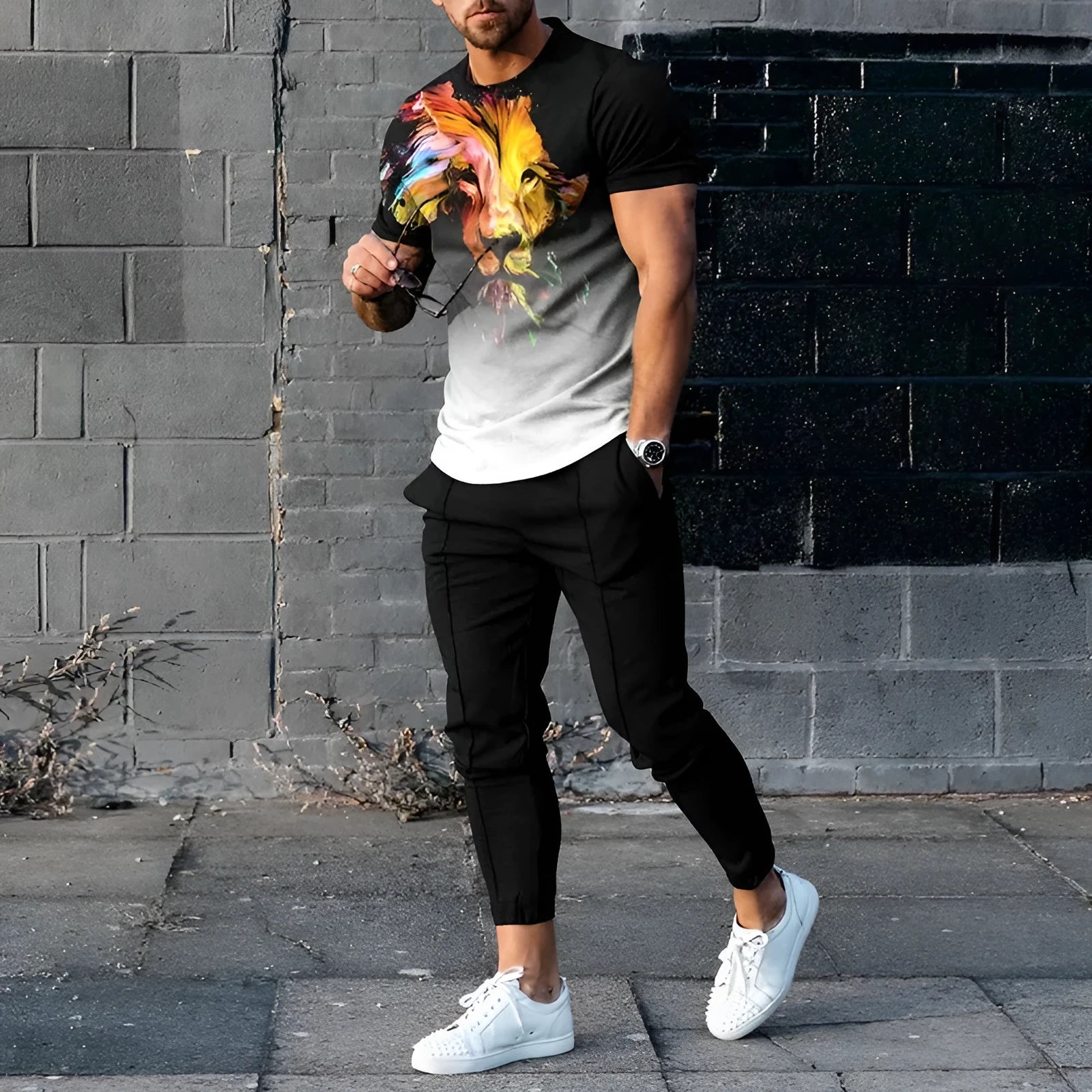 Men's short-sleeved sports top and trousers set with printed design in chemical fibre blend fabric