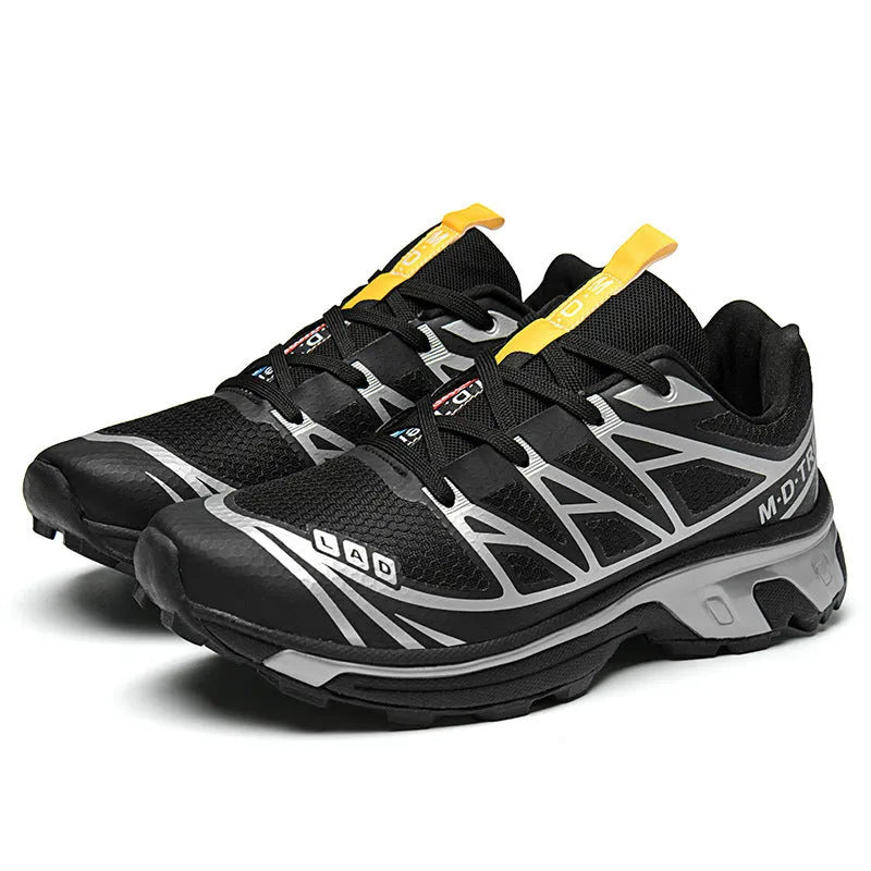 Men's and women's low-top hiking shoes in khaki colour with round toe and lace-up front.