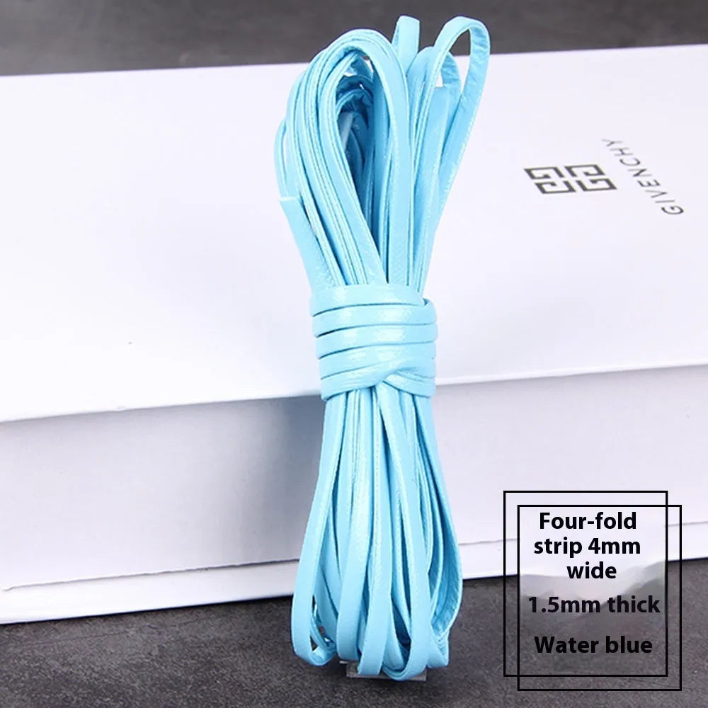 Coiled PU leather woven craft string in multiple colours including beige, black, red, blue, green, gold, and silver.