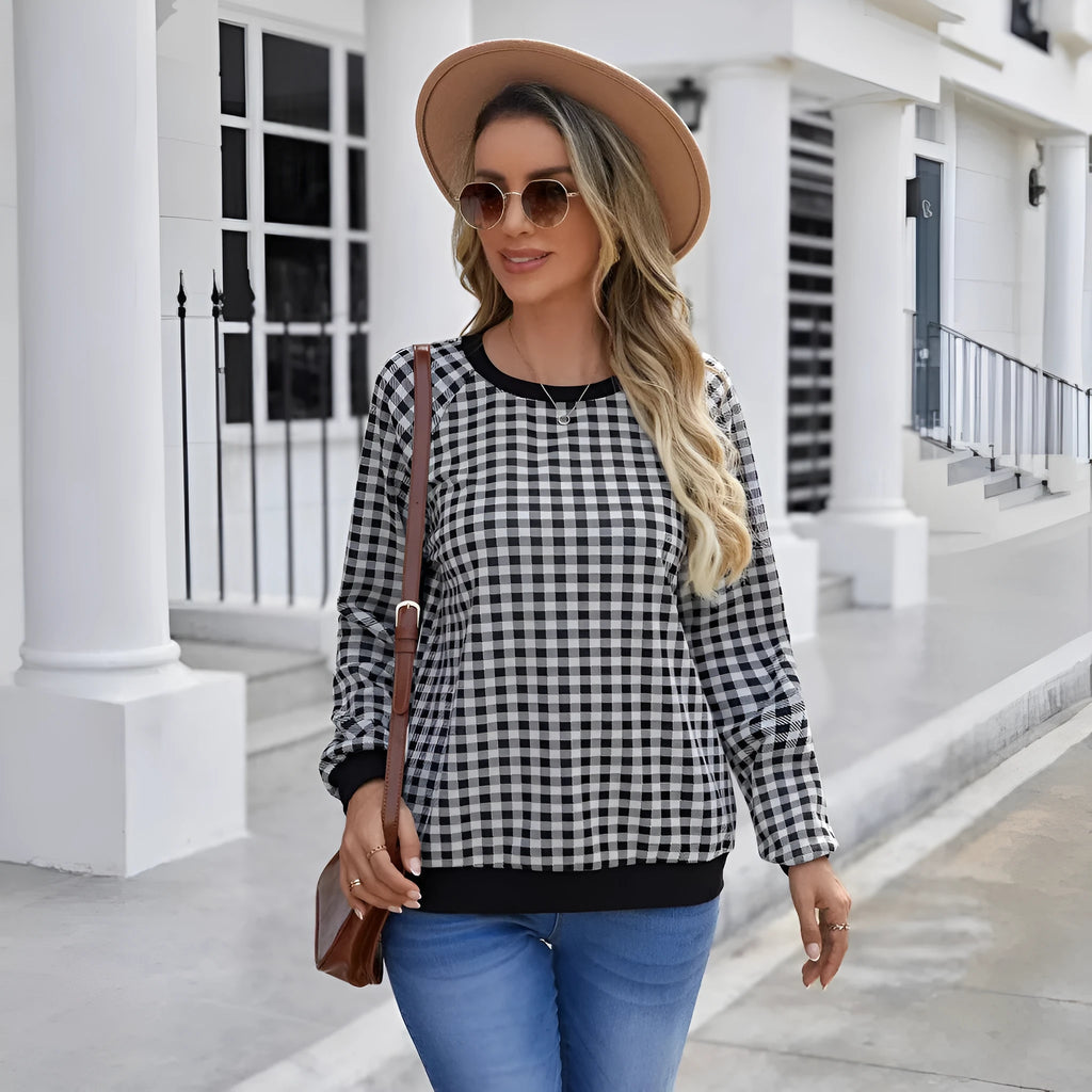 Black long sleeve polyester sweater with striped plaid print pattern