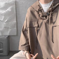 Man wearing a loose fit hooded short sleeve t-shirt in a solid colour for summer.