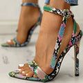 Blue women's high heels with a buckle strap and hollow-out pointed toe design.