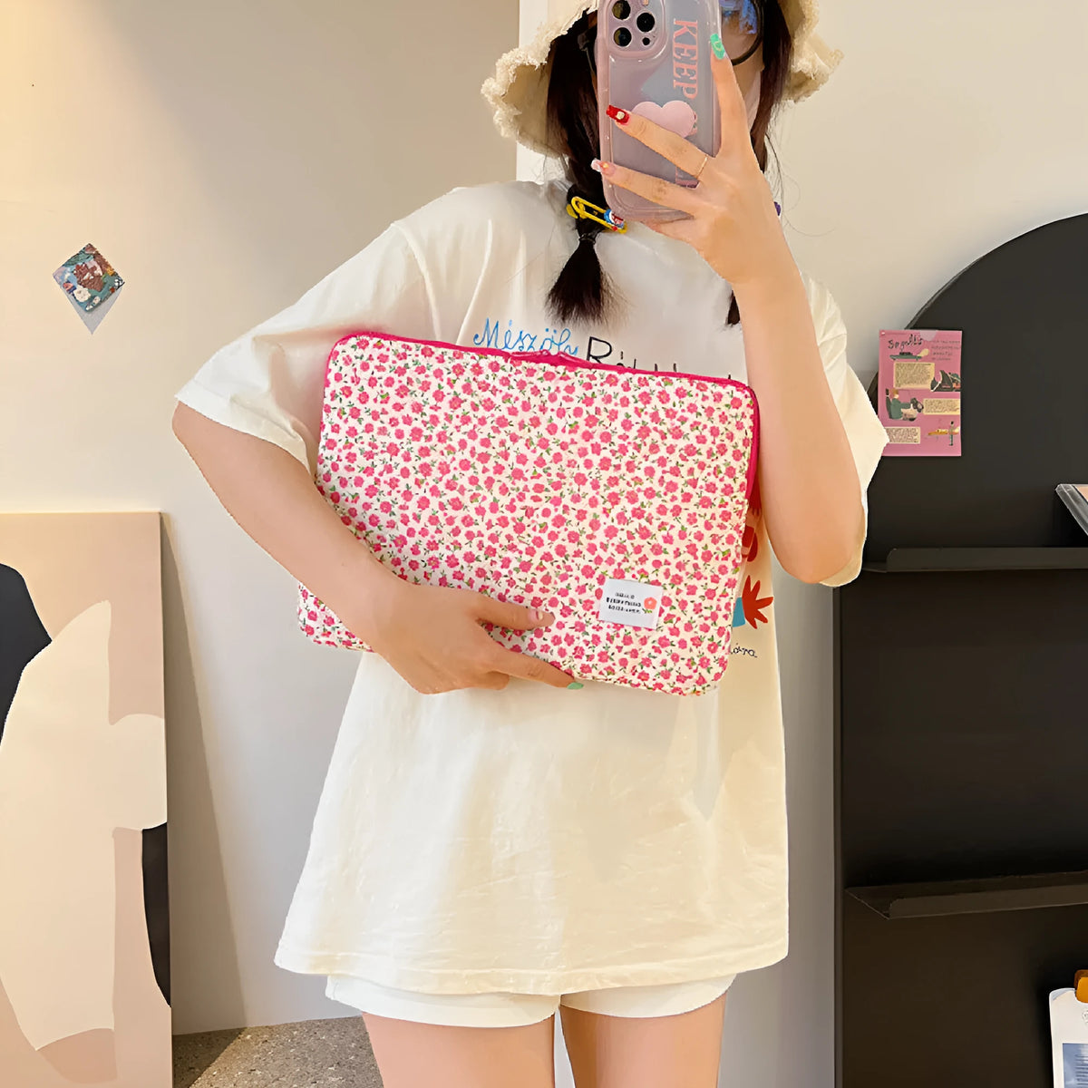 Printed floral design cloth laptop bag for women shown in small, medium, and large sizes.