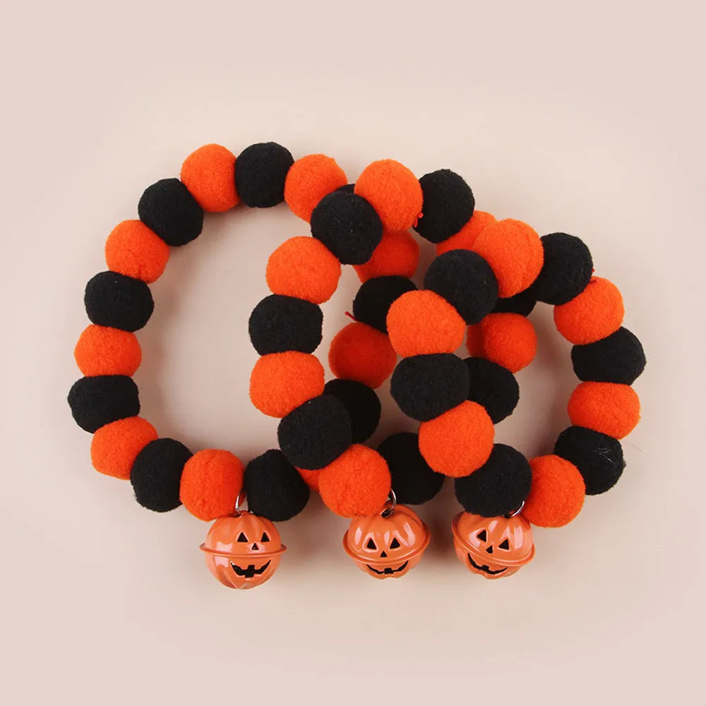 Halloween cat collar with orange pumpkin design showing trick or treat text and ghost bat decorations