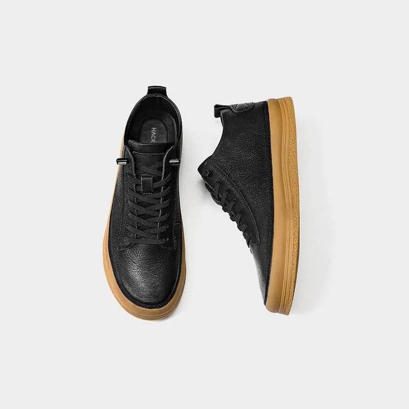 Men's black leather casual shoes with round toe and lace-up closure on rubber sole