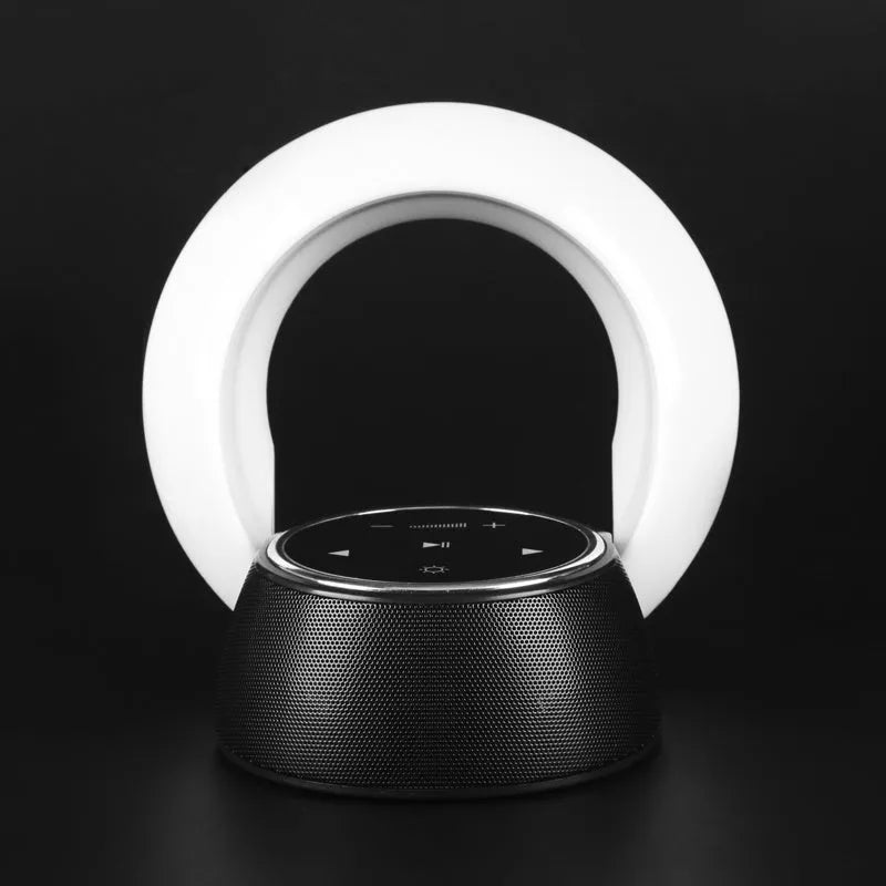Blue and white Bluetooth desk lamp with speaker, shown folded and unfolded on a wooden desk