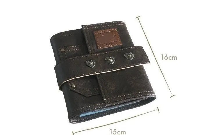 Brown retro leather-style A7 notebook with a buckle closure, shown open to reveal loose-leaf binder binding.