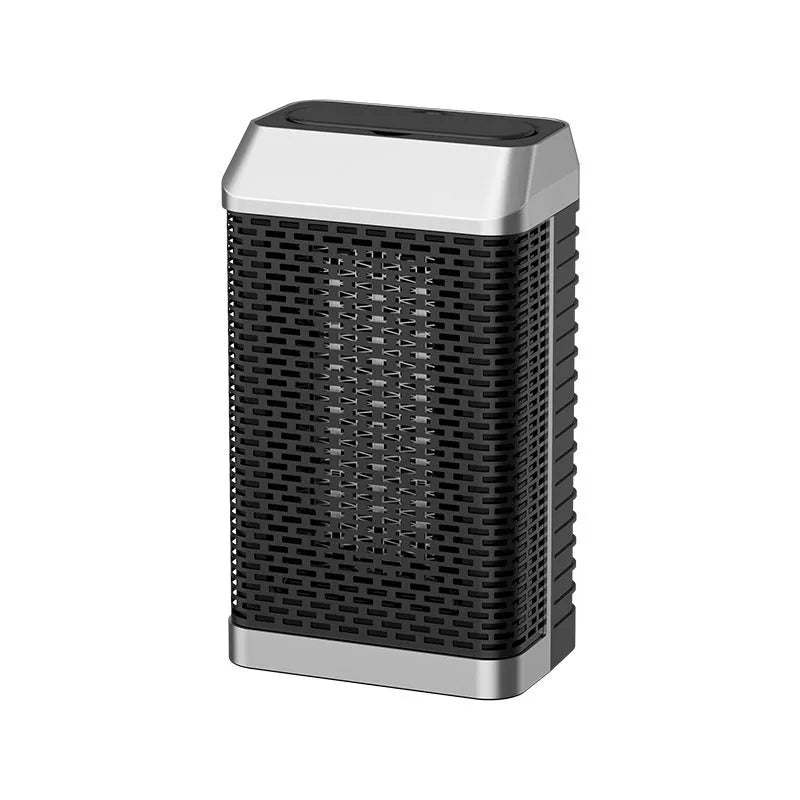 Black remote control desktop space heater with digital display on a wooden desk.