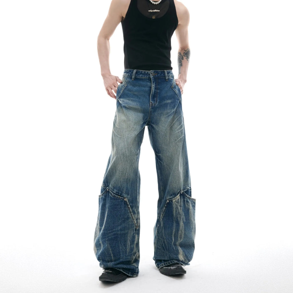 Men's verdant blue loose-fit jeans with a washed burst pattern and curved knife design.