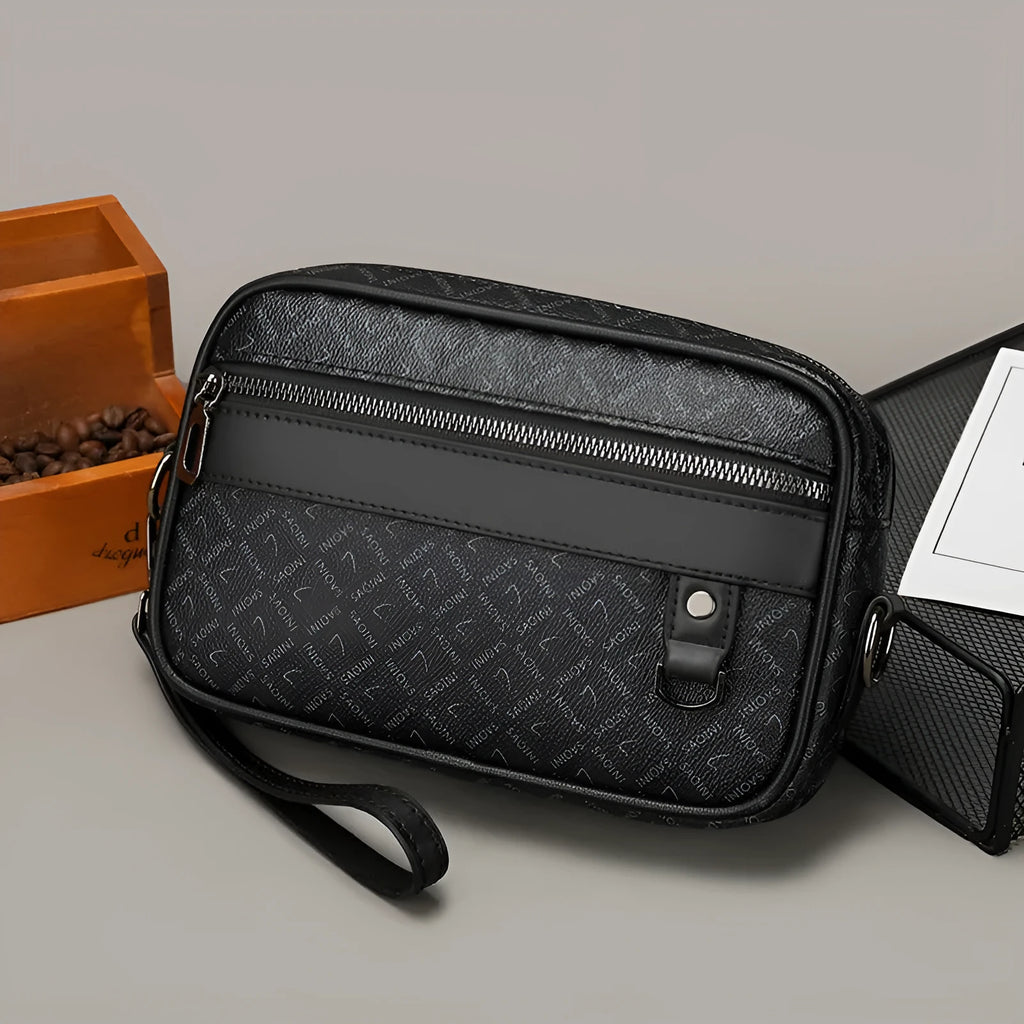 Men's black geometric pattern messenger bag showing shoulder strap and handheld carrying options