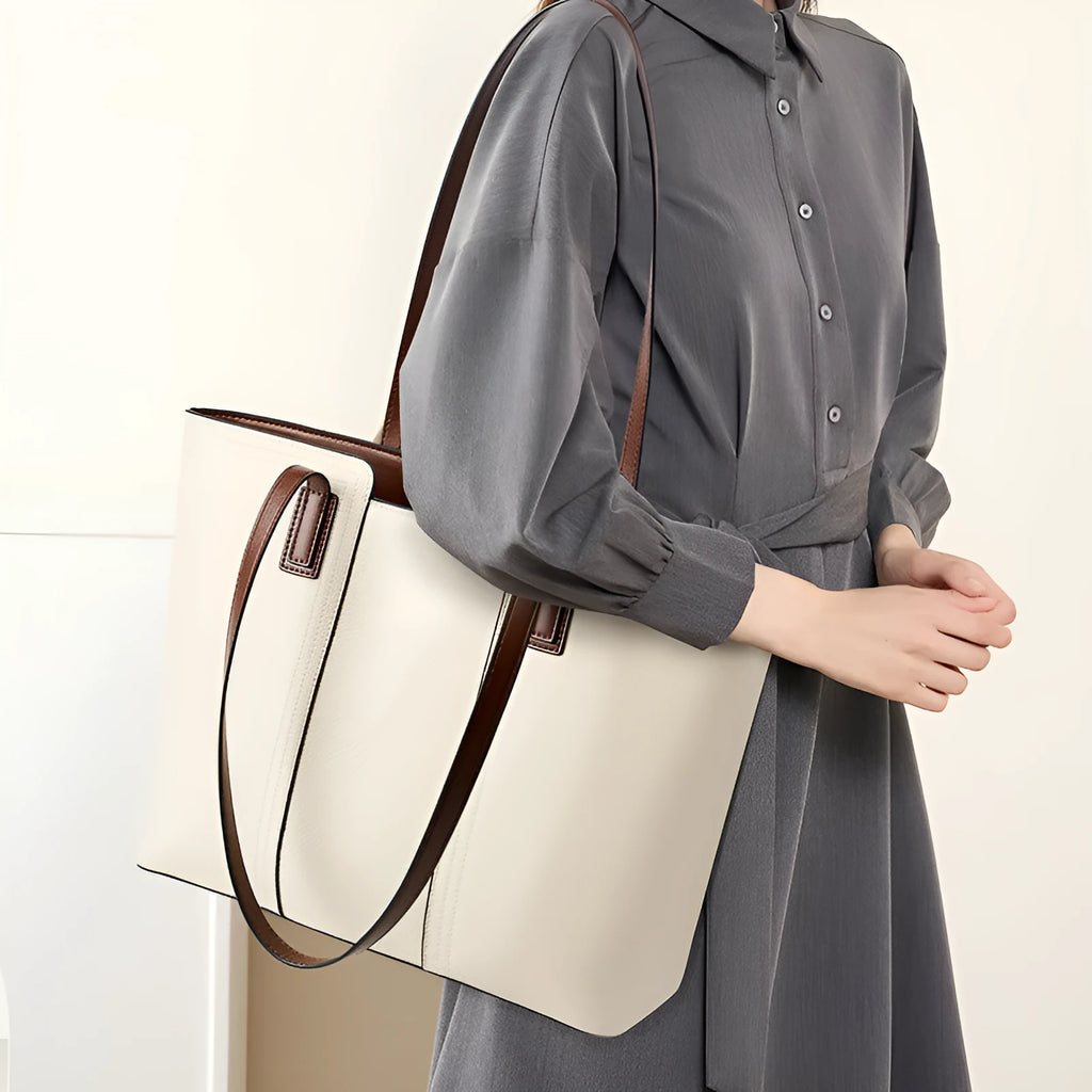 Women's black genuine leather commuter bag with crossbody strap and internal organiser pockets