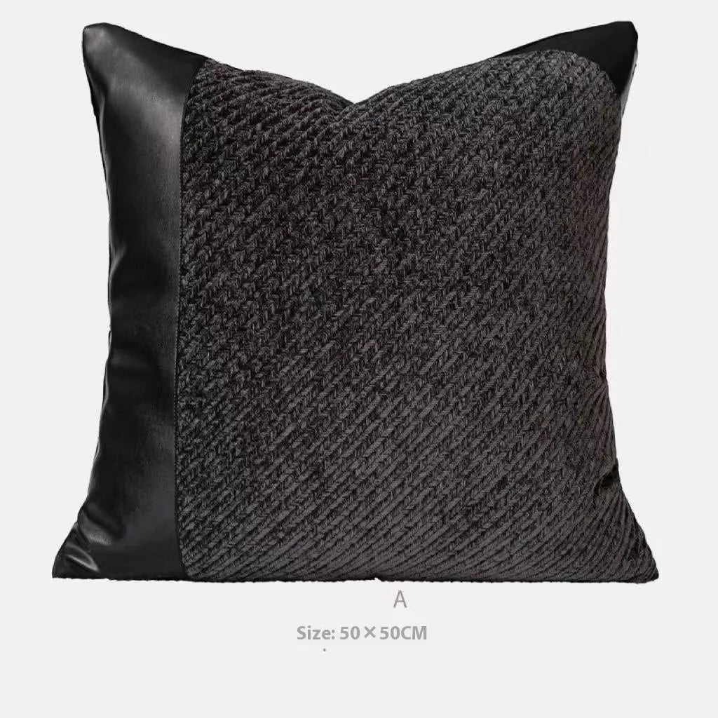 Modern minimalist grey and white plaid bed runner blanket with matching pillowcase and round leather pillow