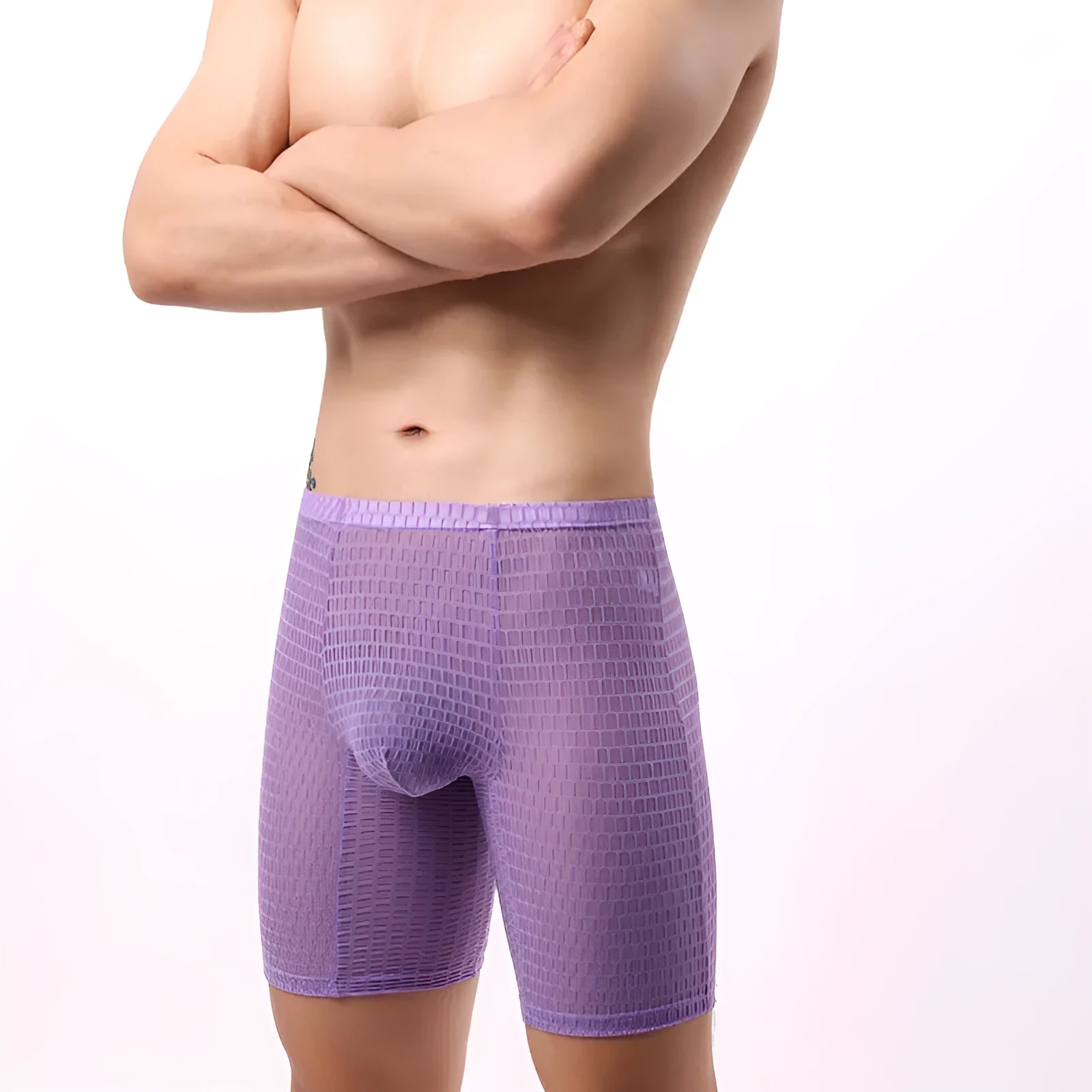 Men's lengthened lace boxer shorts in transparent nylon construction showing shaping design