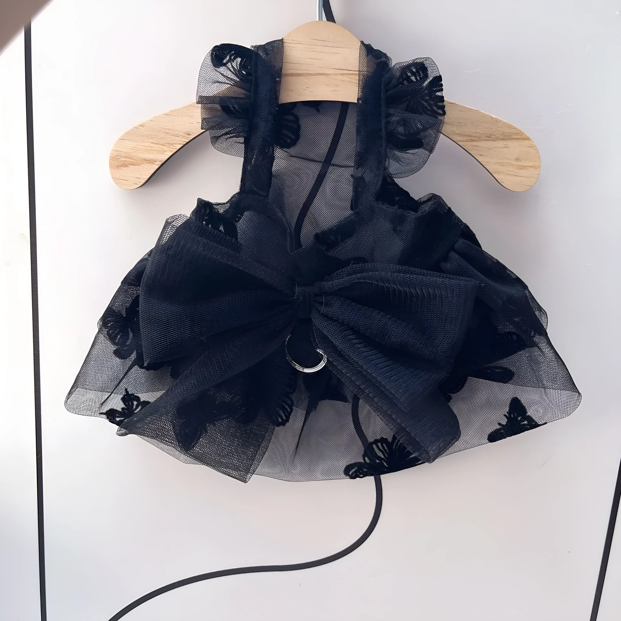 Black gauze princess tulle skirt for a small dog or cat on a mannequin, showing the layered design.