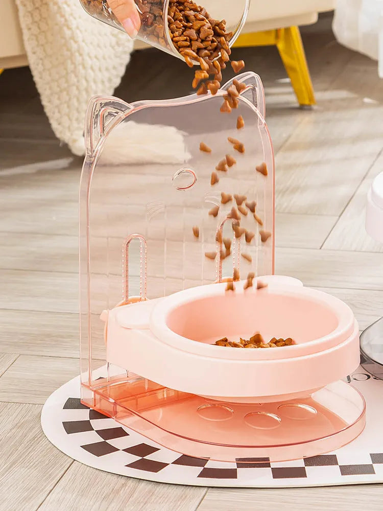 Grey adjustable height cat feeding bowl with cat ears and removable cage on a white background.