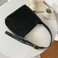 Women's soft PU leather shoulder bag with swing thread details in black or brown, showing dimensions of 28x32x12cm.