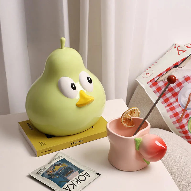 White ceramic pear-shaped tissue box with animal theme in green colour option